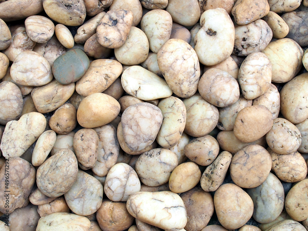 pile of brown beige smooth pebble stone on the beach for background pile of brown beige smooth pebble stone on the beach for background
