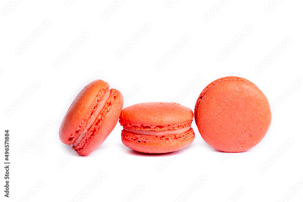 Pink macaroon cakes. Small french muffins. Pink macarons on a white background Pink macaroon cakes. Small french muffins. Pink macarons on a white background