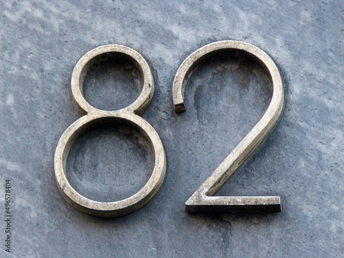 Metal home number on a wall