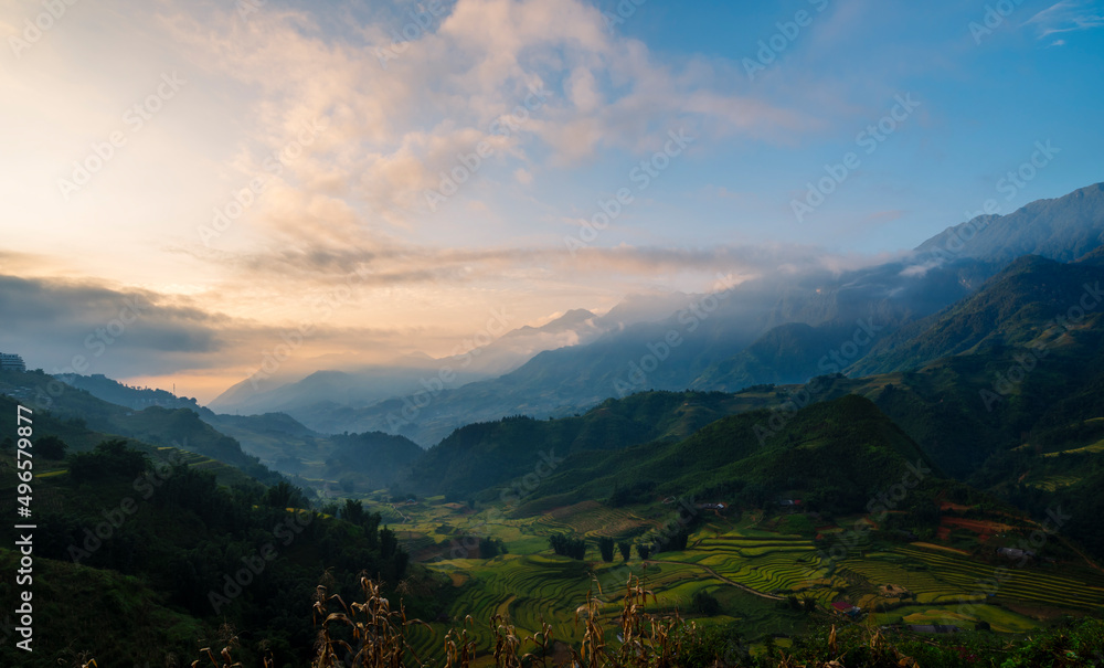 Dramatic sunset over mountain landscape. Beautiful landscape foggy hills twilight time. Blue golden sky sunrise dramatic beautiful landscape mountain. Dawn sky gold dusk time cloudscape with sunlight Dramatic sunset over mountain landscape. Beautiful landscape foggy hills twilight time. Blue golden sky sunrise dramatic beautiful landscape mountain. Dawn sky gold dusk time cloudscape with sunlight