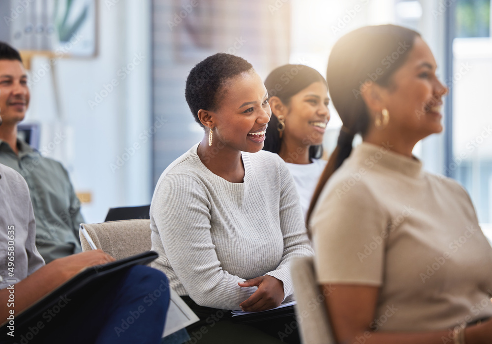 © Nina Lawrenson/peopleimages.com - The journey towards success. Shot of a group of employees laughing during a meeting at work in a modern office.
