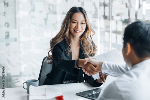 Tableau sur toile Business investor group holding hands, Two businessmen are agreeing on business together and shaking hands after a successful negotiation