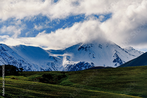 Snow covered peaks in mountain landscape