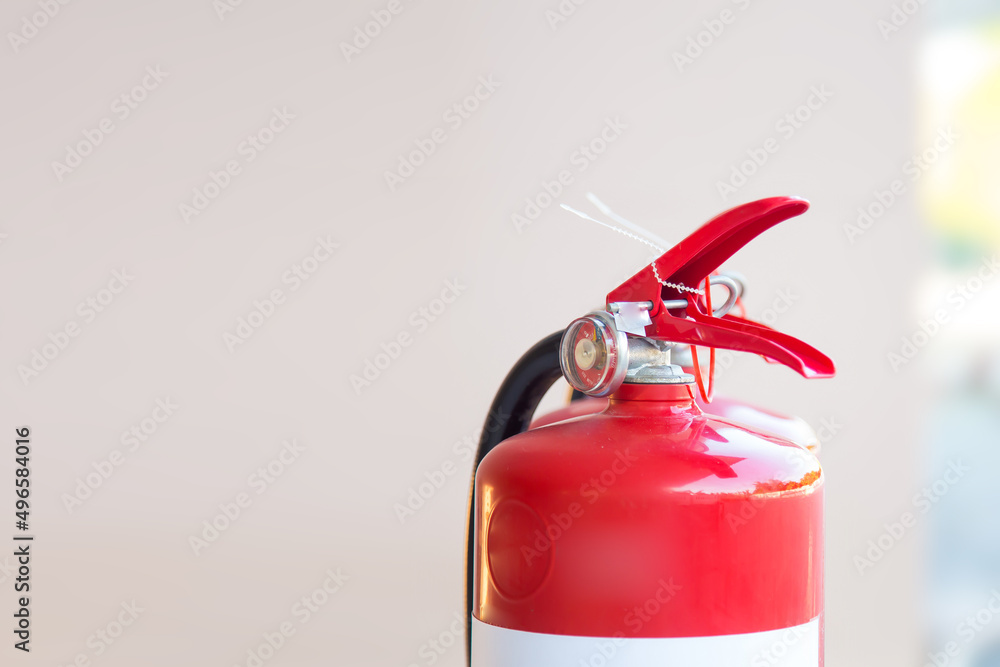 Close up fire extinguisher for protection and prevent and safety rescue and use of equipment on fire training concept.