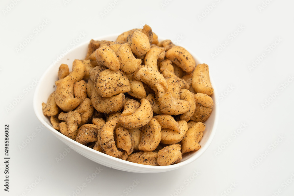 Roasted Namkeen Chatpata Masala Kaju Biscuits Are Spicy Salted Savory Made Of Wheat Flour Maida Ajwain Chilli And Sprinkle Of Black Pepper. Isolated On White Background With Copy Space Roasted Namkeen Chatpata Masala Kaju Biscuits Are Spicy Salted Savory Made Of Wheat Flour Maida Ajwain Chilli And Sprinkle Of Black Pepper. Isolated On White Background With Copy Space