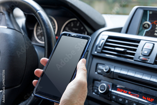 Man using mobile phone in car © dragonstock