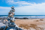 Close-up of a cairn stones against a beach in Hampton Beach, one of the four 