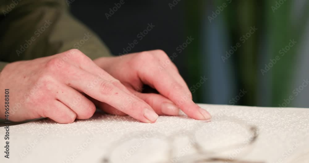 Blind man reading a text of Braille. Braille is a tactile writing system used by people with visual impairments. Blind man reading a text of Braille. Braille is a tactile writing system used by people with visual impairments.