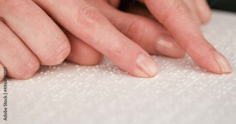 Blind man reading a text of Braille. Braille is a tactile writing system used by people with visual impairments. Blind man reading a text of Braille. Braille is a tactile writing system used by people with visual impairments.