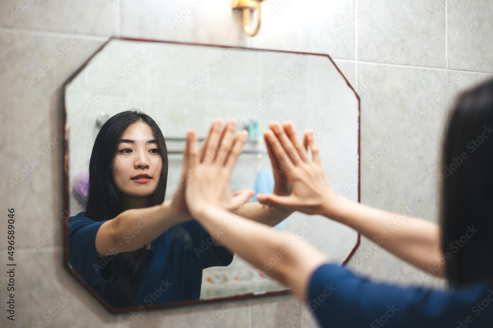 Young adult smile asian woman practice self talk conversation in the morning in bathroom at home. - obrazy, fototapety, plakaty 