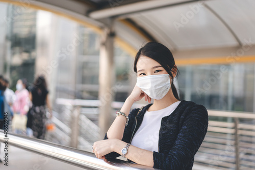 Portrait of beautiful business young adult asian woman wear face mask and accessories