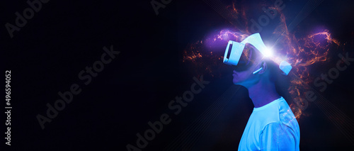 Man is using virtual reality headset. Elements of this image furnished by NASA.