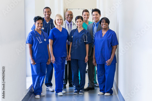 Smiling portrait multi ethnic team providing healthcare modern medical facility