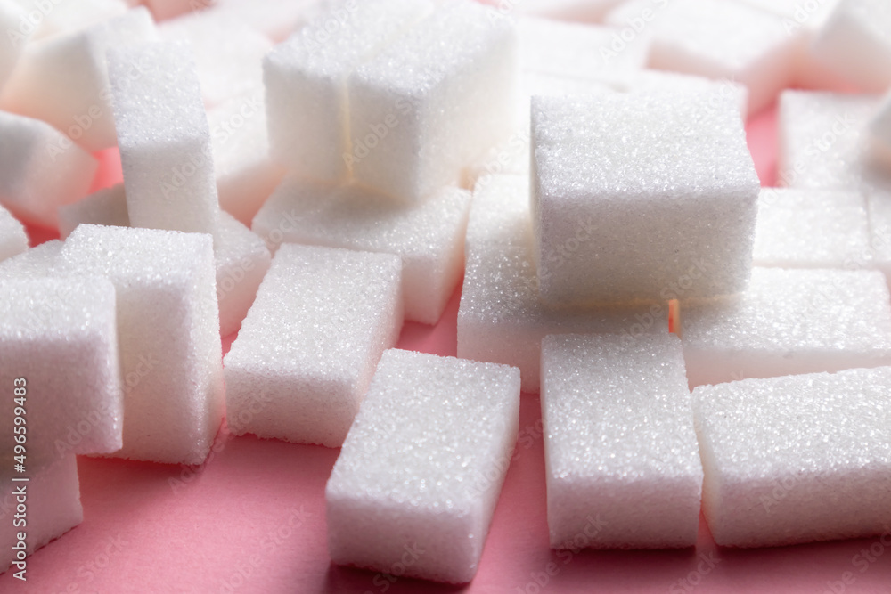 sugar cubes on a pink background. sugar cubes on a pink background.