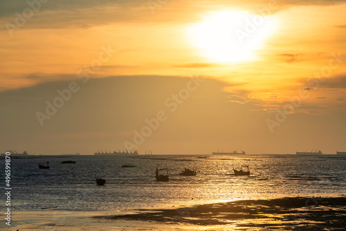 Silhouette fishing boats and cargo ships at sunset, Sriracha
