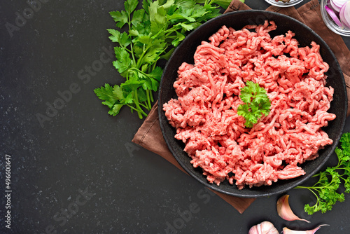 Raw beef minced meat on plate.