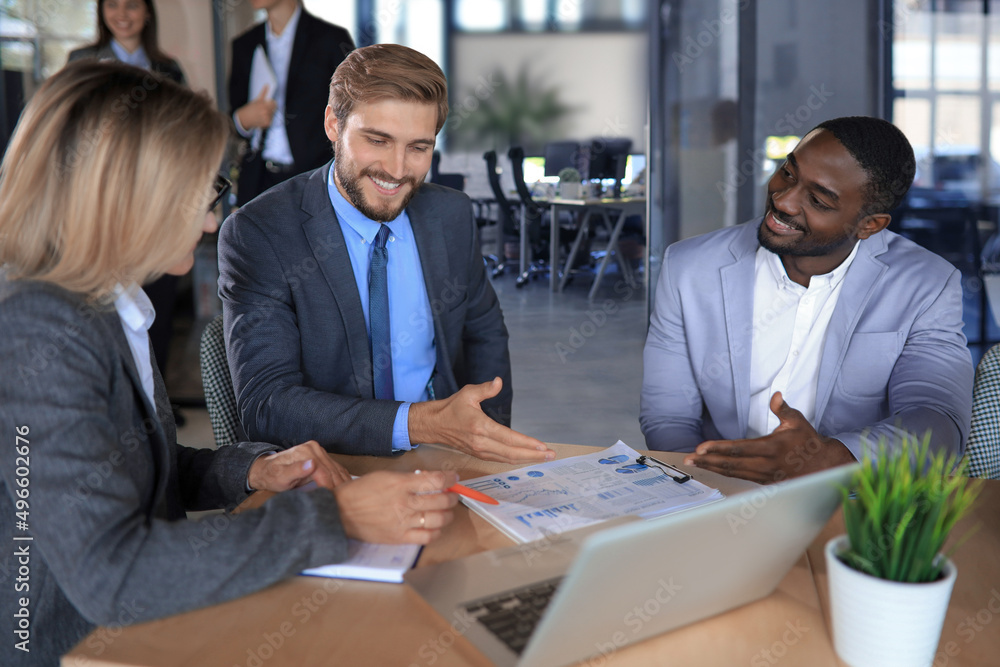 Business meeting - manager discussing work with his colleagues. Business meeting - manager discussing work with his colleagues.