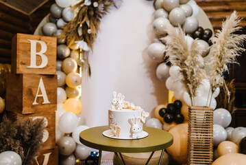 Birthday Cake on a background balloons party decor. Baby shower party, decor. Celebration baptism concept. Copy space. Celebration concept. Trendy Cake. Delicious reception.