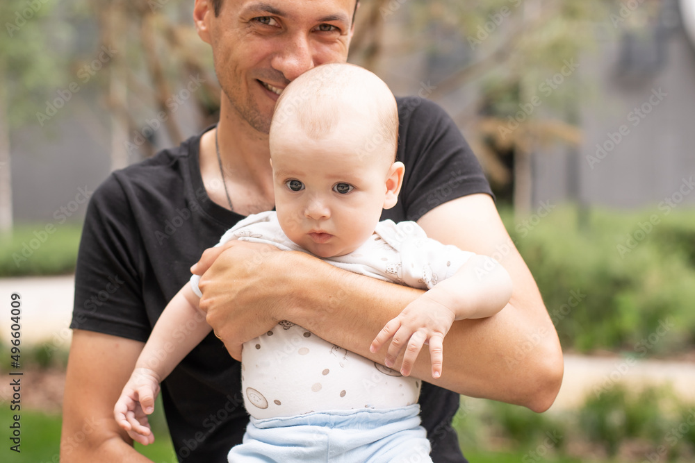 Fototapeta premium baby boy outdoor playing with father.