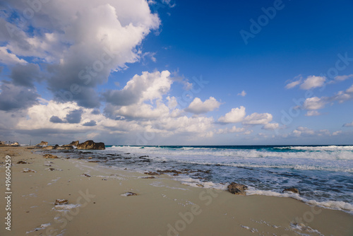 Windy and Rocky Coastline of the Mediterranean Sea in the Marsa Matruh city under Blue Cloudy sky with no People around, Egypt photo