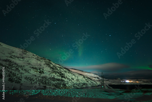 Landscape. The Northern lights in the sky beyond the Arctic Circle.
