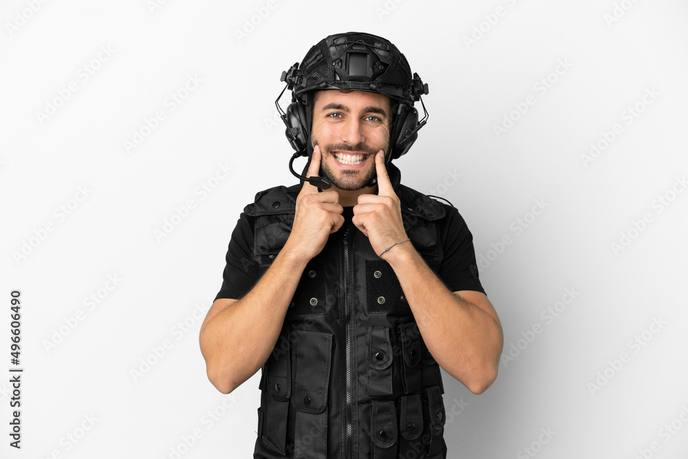 Young caucasian swat isolated on white background smiling with a happy and pleasant expression Young caucasian swat isolated on white background smiling with a happy and pleasant expression