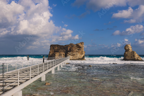 Wooden Bridge to the Stone Rocky Formation on the Cleopatra Beach on the Mediterranean Sea Coastline near Marsa Matruh city, Egypt photo