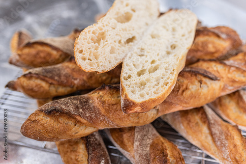 sliced bread lies on golden buns, freshly baked © Павло Товтин