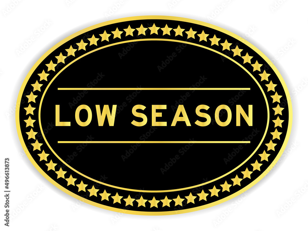 Black and gold color round label sticker with word low season on white background Black and gold color round label sticker with word low season on white background
