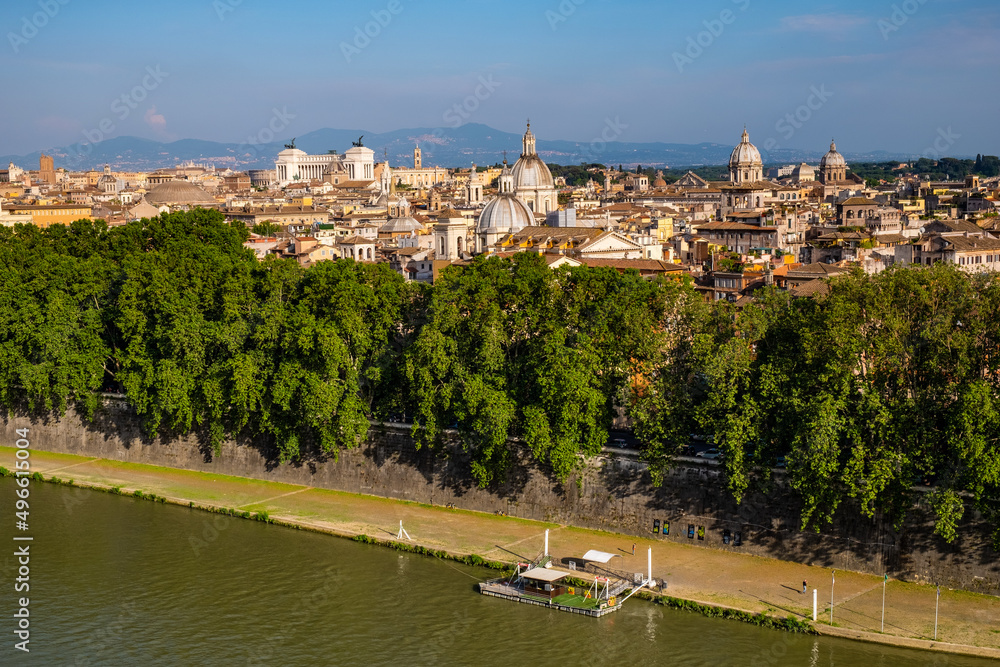 Panorama of historic center of Rome in Italy over Tiber river and Lungotevere Tor di Nona embankment aside Ponte Sant'Angelo Saint Angel Bridge