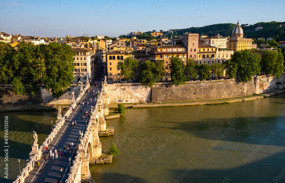 Panorama of Rome historic center over Ponte Sant'Angelo, Saint Angel Bridge, known as Aelian Bridge or Pons Aelius at Tiber river in Italy