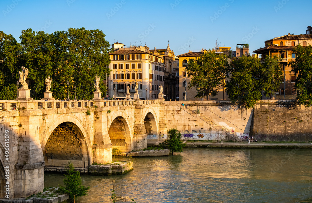 Panoramic view of Tiber river and Lungotevere Tor di Nona embankment aside Ponte Sant'Angelo Saint Angel Bridge in historic city center of Rome in Italy