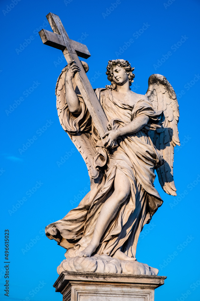 Angel with the Cross statue by Ercole Ferrata on Ponte Sant'Angelo Saint Angel Bridge over Tiber river in historic center of Rome in Italy Angel with the Cross statue by Ercole Ferrata on Ponte Sant'Angelo Saint Angel Bridge over Tiber river in historic center of Rome in Italy