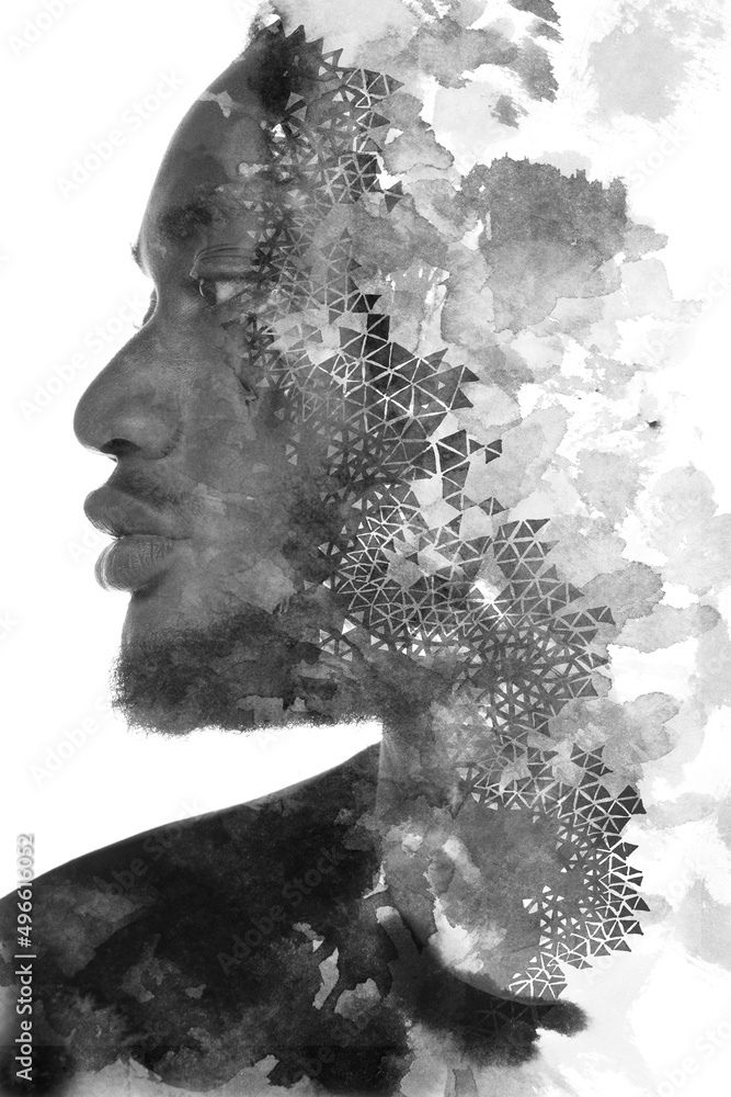 A double exposure portrait of a man combined with abstract geometric shapes.