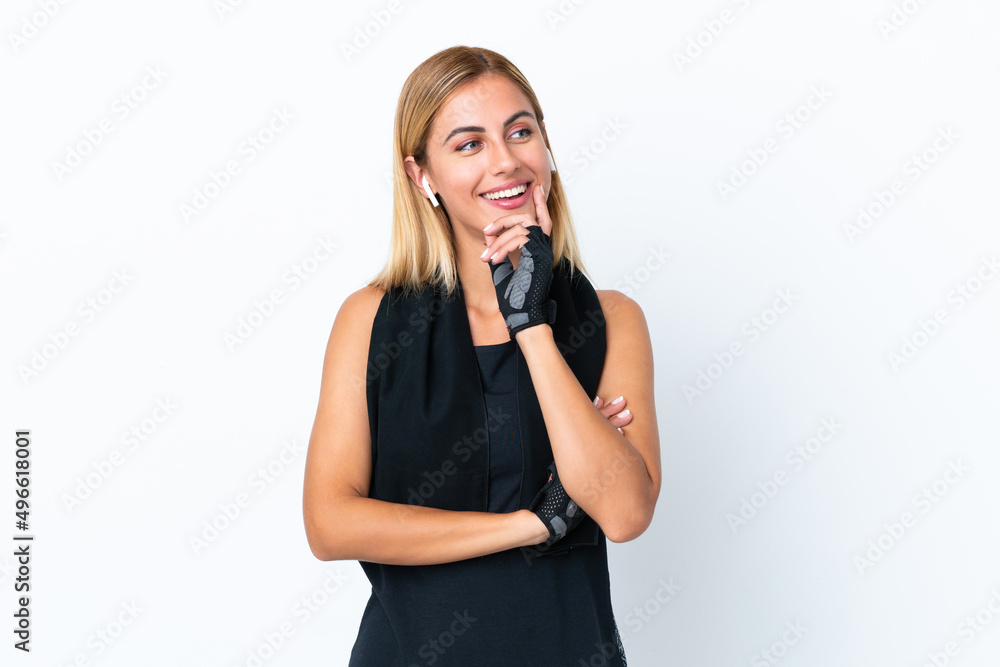 Blonde Uruguayan sport girl isolated on white background looking to the side Blonde Uruguayan sport girl isolated on white background looking to the side
