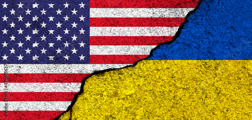 USA and Ukraine. Flags painted on cracked concrete wall. United States, America. Partnership, relationships and conflict concept. Banner background photo