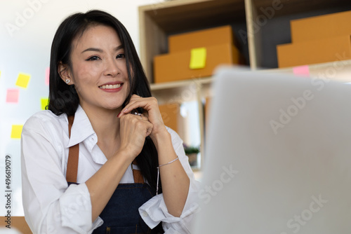 Asian woman starting a small business selling online.