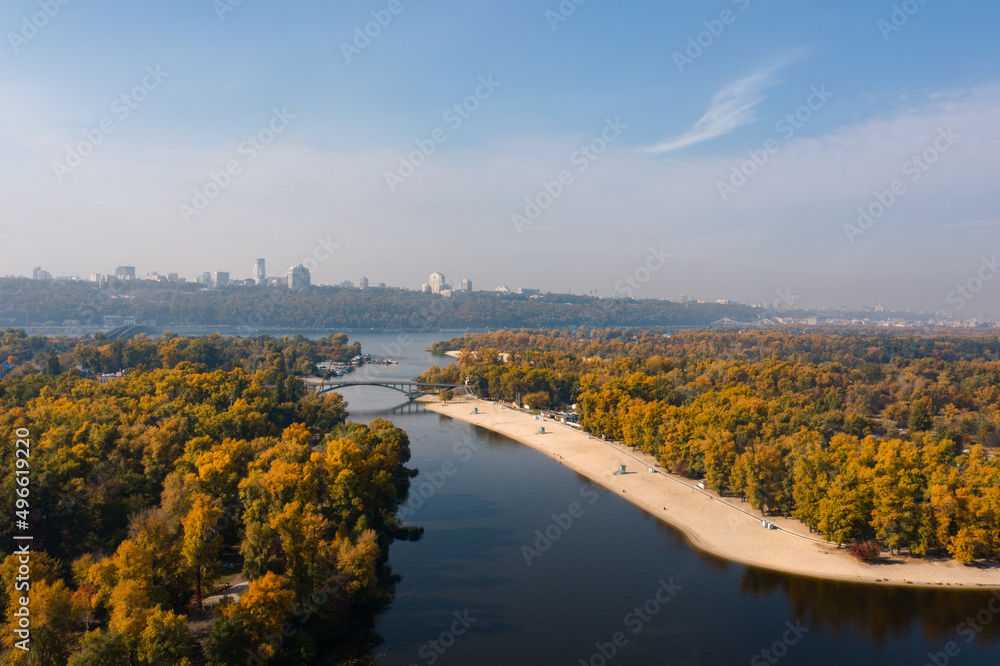 Autumn view of the Dnieper River in Kiev and the city center on the horizon with a large park