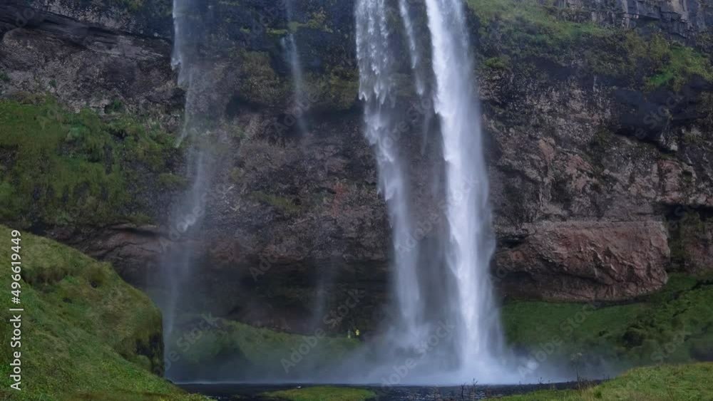 Picturesque waterfall Seljalandsfoss autumn view, southwest Iceland. People unrecognizable.
Picturesque waterfall Seljalandsfoss autumn view, southwest Iceland. People unrecognizable.