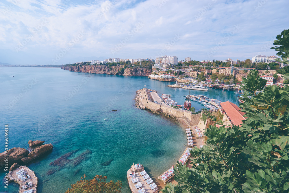 Landscape with sea marina and ancient building on cliff. Antalya Turkey.