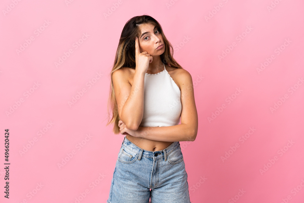 Young caucasian woman isolated on pink background thinking an idea Young caucasian woman isolated on pink background thinking an idea