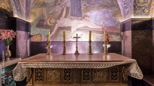 Cross and candles in the Church of the Holy Sepulcher timelapse hyperlapse. photo