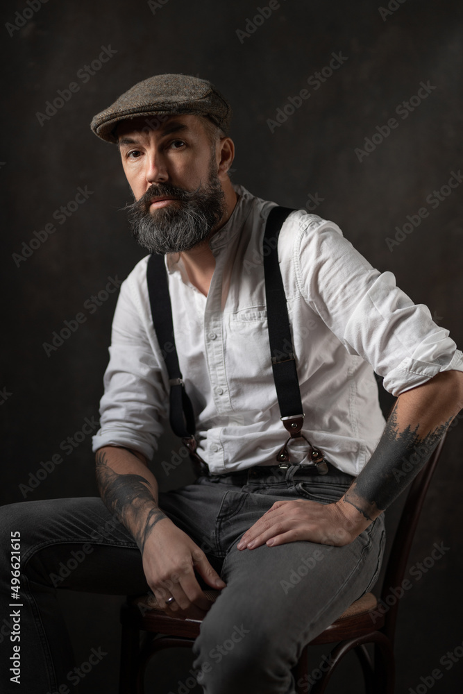 Obraz premium Portrait of mature bearded man in vintage style. Hipster concept. High quality photo
