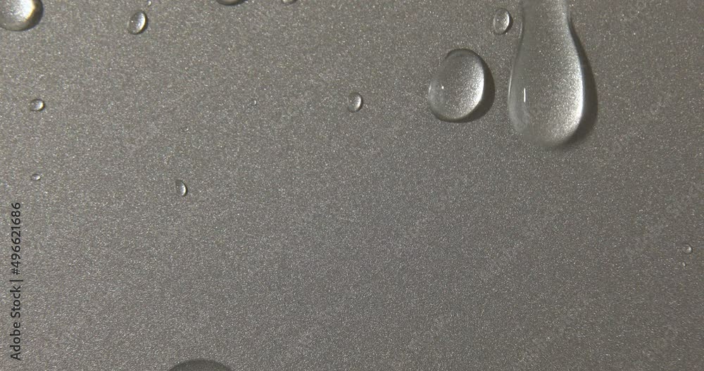 Abstract water drops on grey silver background, macro, Bubbles close up, Cosmetic liquid drops, Flat lay pattern. Abstract water drops on grey silver background, macro, Bubbles close up, Cosmetic liquid drops, Flat lay pattern.