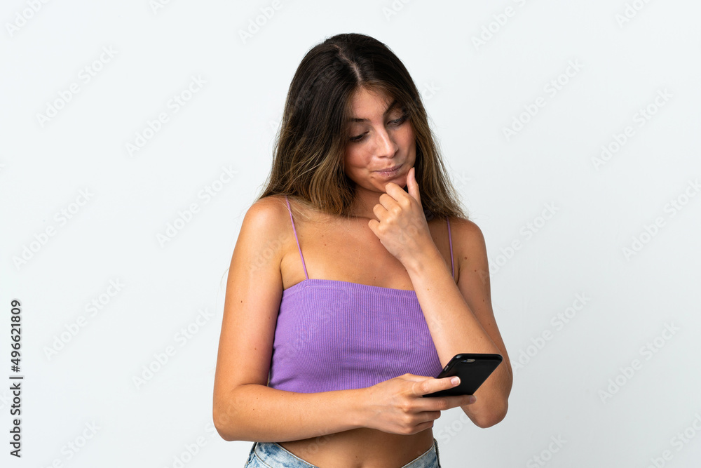 Young caucasian woman isolated on white background thinking and sending a message Young caucasian woman isolated on white background thinking and sending a message