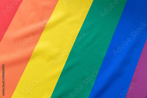 Rainbow flag, LGBT Gay pride symbol background texture, overhead. LGBTQ community rights
