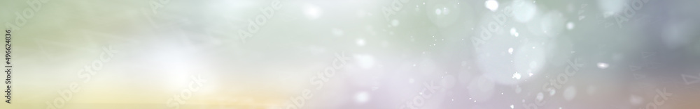 abstract narrow long background / glowing blurred winter background, snowflakes on a blurred multicolored background, abstraction winter