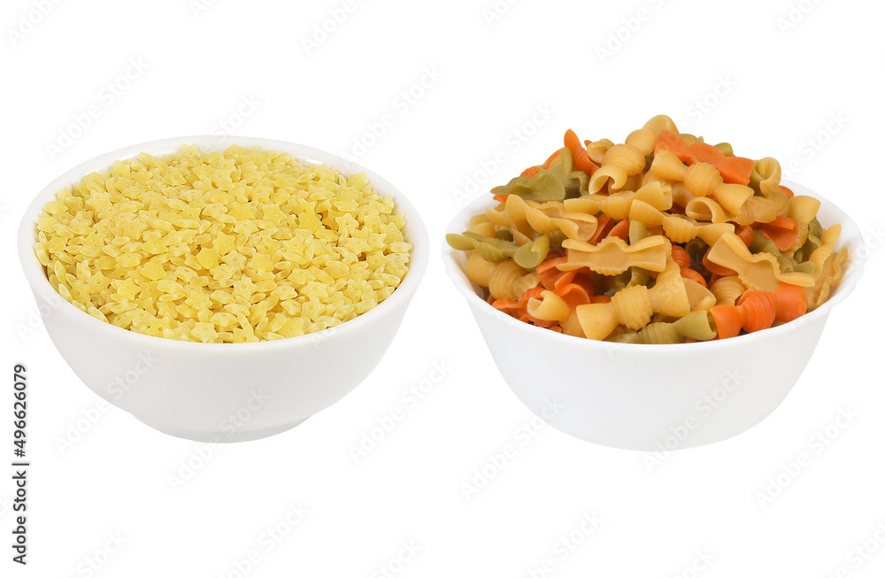 Pasta on an isolated white background. Set of two types of macrons in white bowls Pasta on an isolated white background. Set of two types of macrons in white bowls