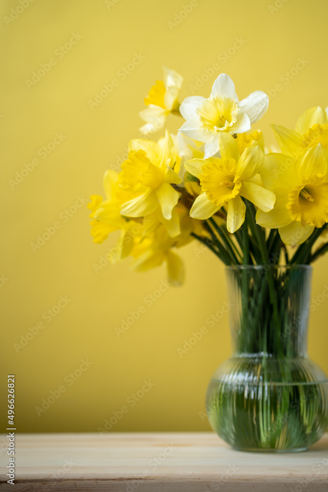 bouquet of yellow daffodils in a vase on a bright background, spring flowers bouquet of yellow daffodils in a vase on a bright background, spring flowers