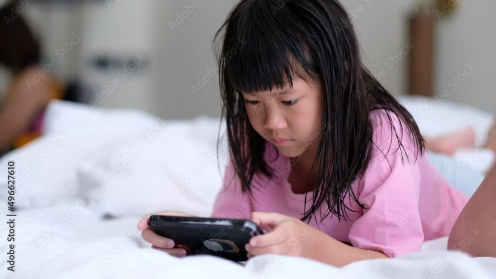 kid watching tablet on the bed, child addicted cartoon
kid watching tablet on the bed, child addicted cartoon